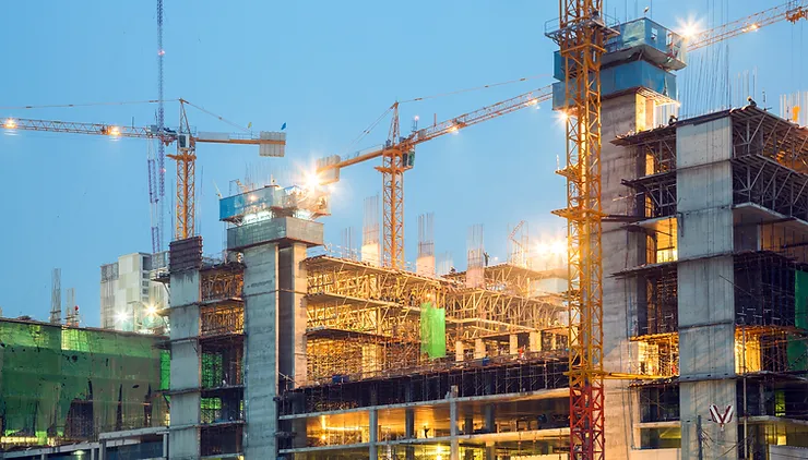 Large construction site with cranes and scaffolding